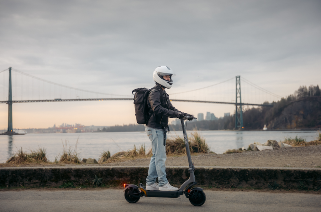 a man on a apollo city pro scooter