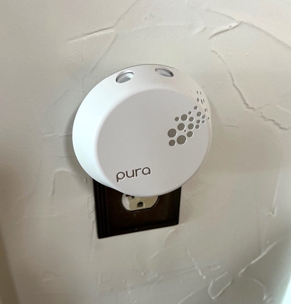 a pura diffuser plugged in to wall