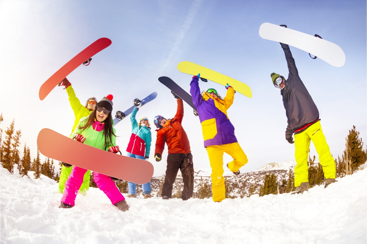 a bunch of snowboarders with colorful boards and gear
